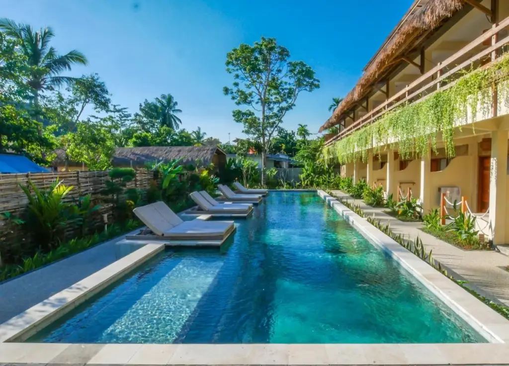 wooden bungalows in a lush garden setting